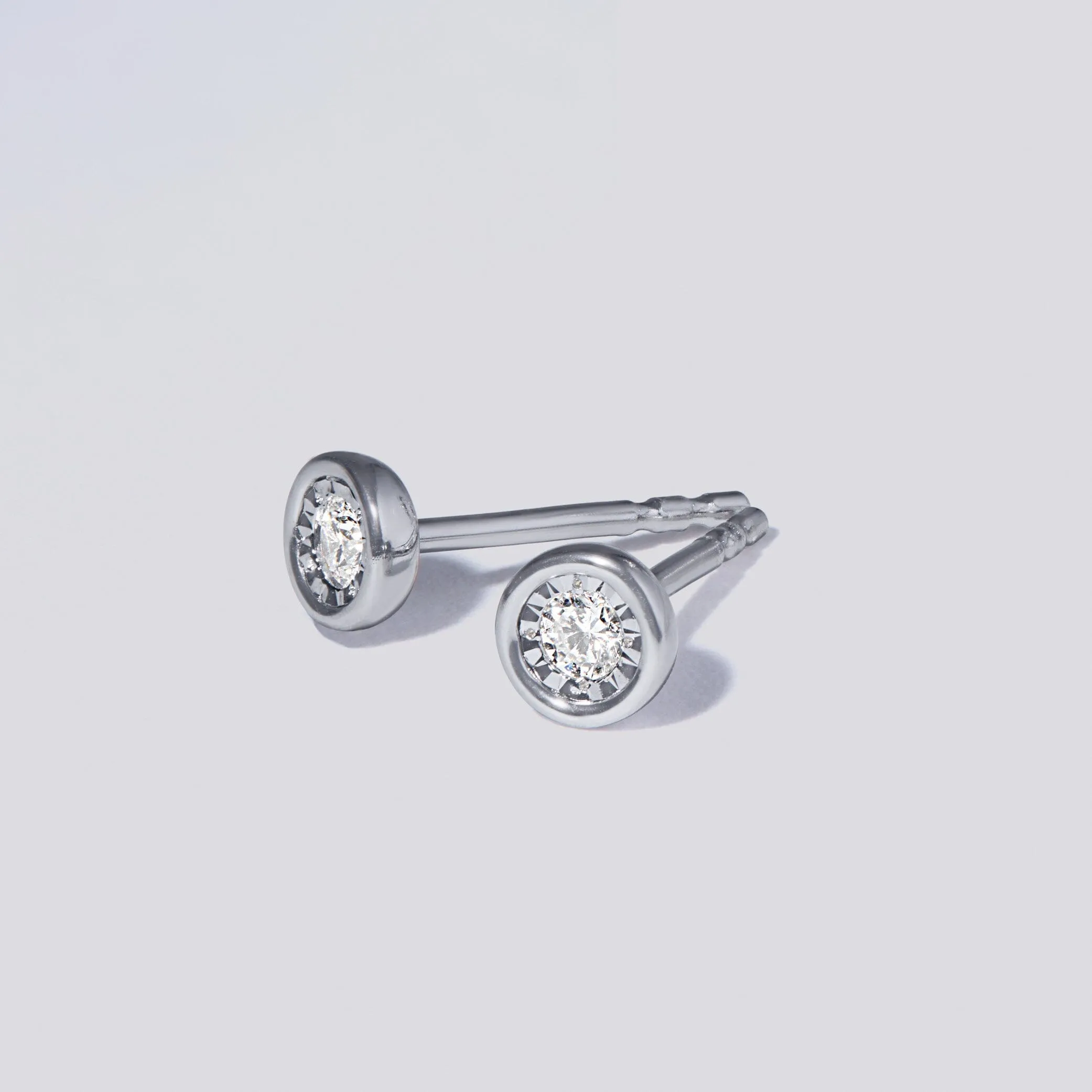 Mirage Stud Earrings with 0.10ct of Laboratory Grown Diamonds in Sterling Silver and Platinum